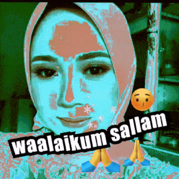 a woman wearing a hijab with the words waalaikum salaam written on it