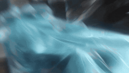 a blue and black background with a swirling pattern