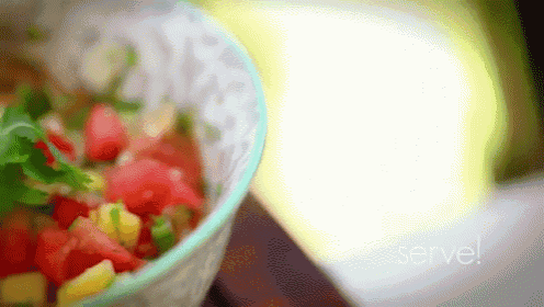 a blurred image of a bowl of food with the words serve written on the bottom