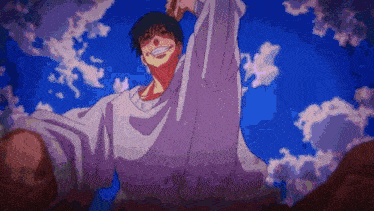 a man is standing in front of a blue sky with his arms in the air .