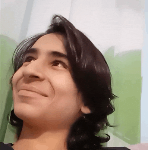 a close up of a person 's face with long hair