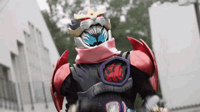 a close up of a person in a costume with a helmet and a scarf around their neck .