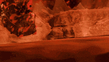 a video game character is surrounded by red flame