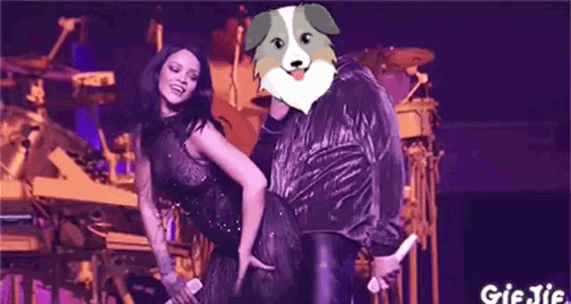 a man is carrying a woman on his back on a stage with a dog on his head .