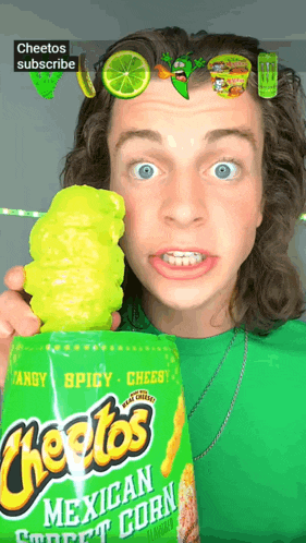a man holds a bag of cheetos mexican corn