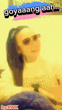 a woman wearing sunglasses and a shirt that says goyaang aah on it