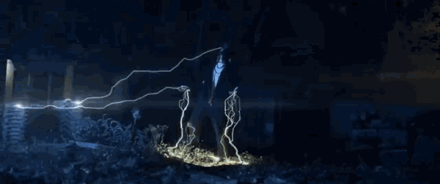 a man is surrounded by lightning strikes in the dark