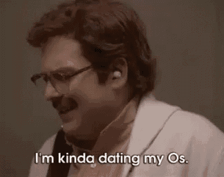 a man wearing glasses and a pink shirt is saying `` i 'm kinda dating my os '' .