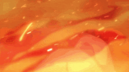 a close up of a person 's face surrounded by fire .