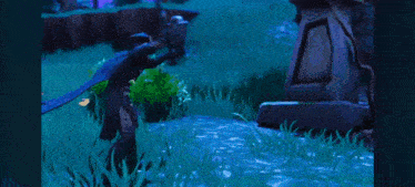 a man and a woman are standing next to each other in a field in a video game .