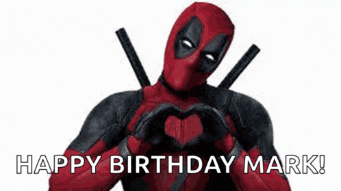 deadpool is making a heart shape with his hands and saying `` happy birthday mark '' .