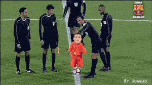 a man in an orange shirt is standing in front of a soccer jersey with the number 10 on it