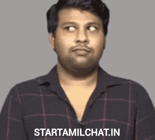 a man in a plaid shirt has the words starttamilchat.in on the bottom of his shirt