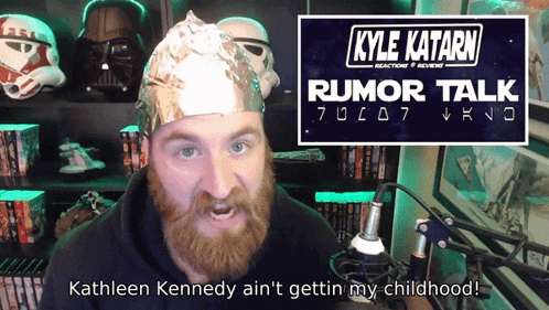 a man wearing a tin foil hat with kyle katarn rumor talk written on it