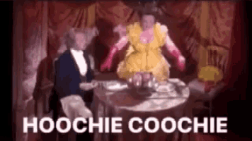 a woman in a yellow dress is sitting at a table with a man in a suit and gloves .