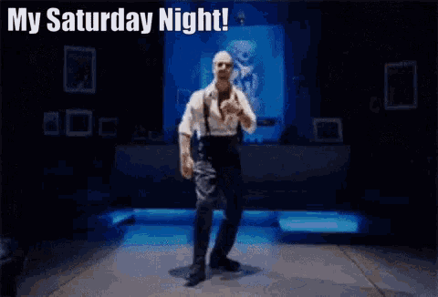 a bald man wearing sunglasses says my saturday night !