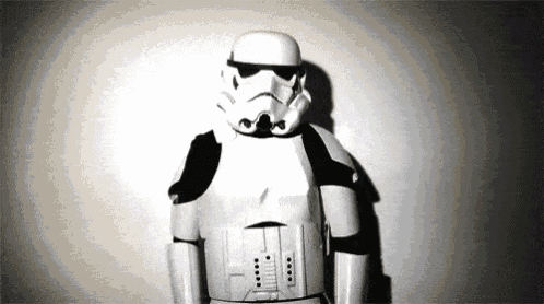 a storm trooper is standing in front of a white wall