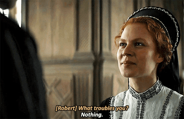 a woman with red hair is talking to a man with the words robert what troubles you nothing
