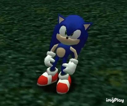 sonic the hedgehog is standing on a grassy field in a video game .