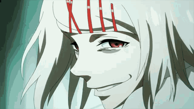 a close up of a person 's face with red eyes