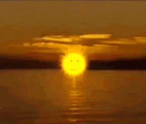 a sunset over a body of water with a purple sky