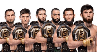 a group of men standing next to each other holding ufc championship belts