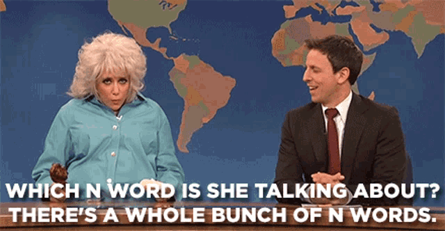 a man and a woman are sitting in front of a map of the world and talking about which n word is she talking about