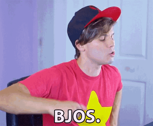 a man wearing a red shirt with a yellow star on it and a hat says bjos