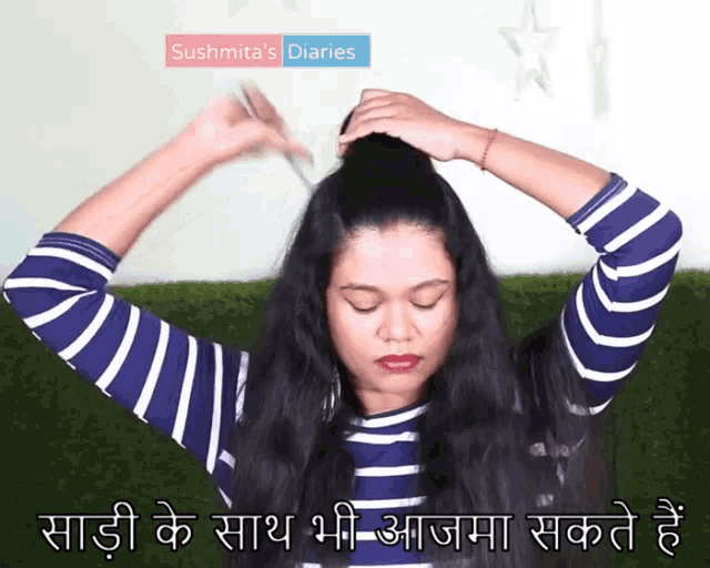 a woman in a blue and white striped shirt is holding her hair in a bun with the words sushmita 's diaries above her