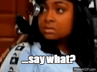 a woman says " say what " while wearing a helmet