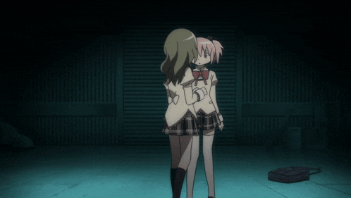two anime girls are standing next to each other in a dark room with a bag on the floor