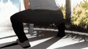 a person is squatting on a bench with a shadow on the ground