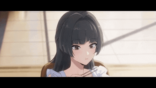 a girl with black hair is sitting in a chair holding chopsticks .