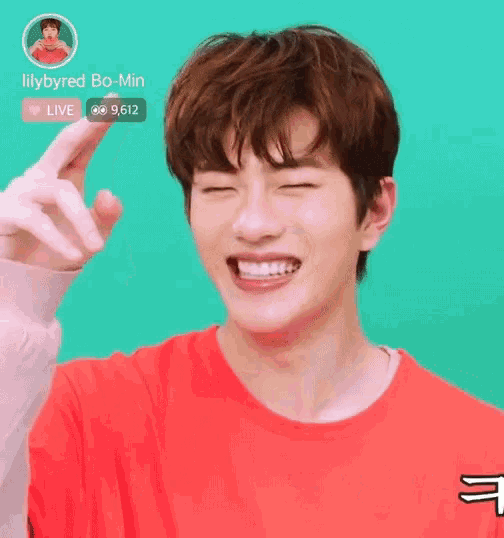 a young man wearing a red shirt with the name lilybyred bo-min on the top