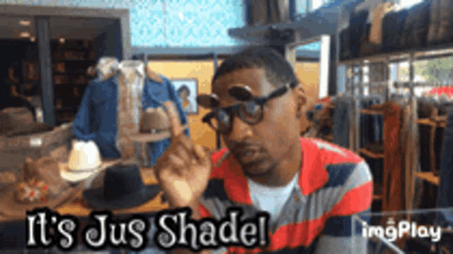 a man wearing glasses says it 's jus shadel