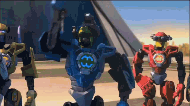 a robot with the letter h on its chest is standing next to another robot