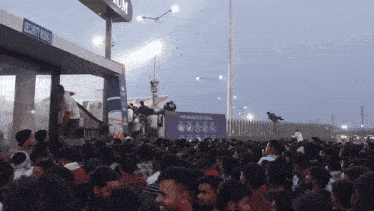 a crowd of people gathered outside a security room