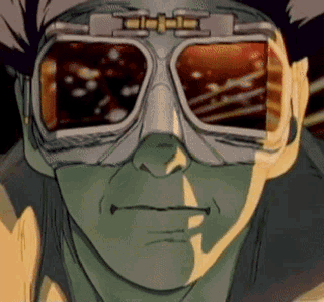 a close up of a person wearing goggles with a reflection of the sun