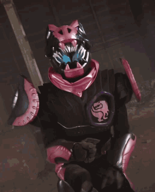 a person in a pink and black costume with a purple eye