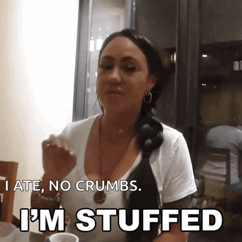 a woman says i 'm stuffed while eating