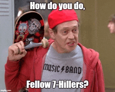 a man in a red hat is holding a skateboard and wearing a shirt that says music band