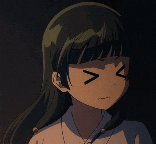 a close up of a girl 's face with a smirk