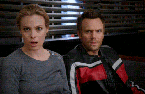 a man and a woman are sitting next to each other and the woman is wearing a motorcycle jacket