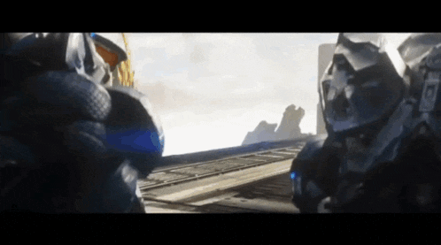 two robots are standing next to each other and one of them has the letter a on it