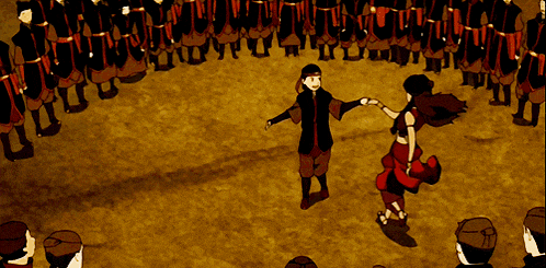 a man and woman are dancing in front of a crowd
