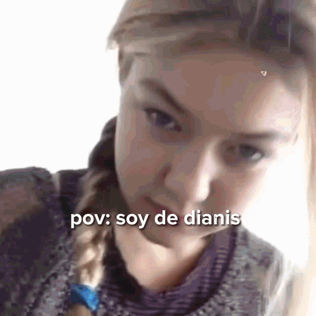 a close up of a woman 's face with the words pov : soy de dianis on the bottom