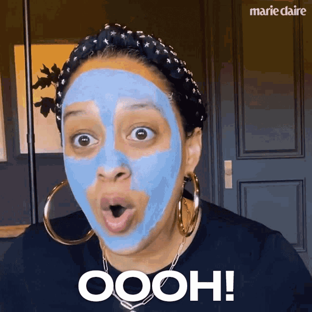 a woman with a blue mask on her face says oooh !