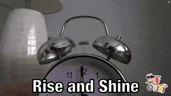an alarm clock with the words rise and shine written on it