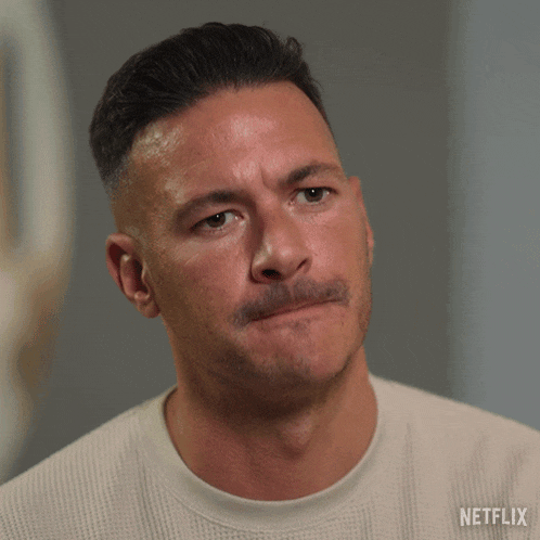 a man with a mustache is wearing a sweater that says netflix