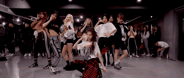 a group of young women are dancing in a dance studio